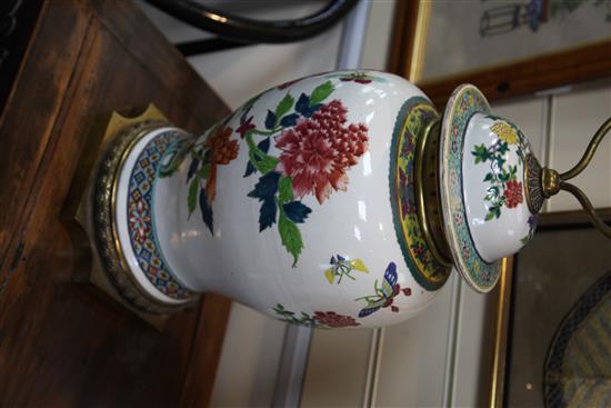 A pair of large Chinese famille rose baluster jars and covers, late 19th / early 20th century, 80.5cm to top of brass fittings